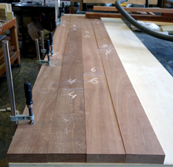 Robinson Table - Laying out the wood floor pattern for a mahogany table top before gluing