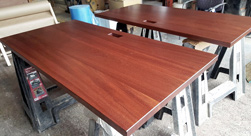 Bandera Table - Two mahogany table tops with custom grommet cut for a hotel office