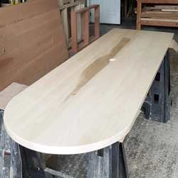 Sedona Table - Custom half-oval maple table top with grommet cut in center going in a conference room