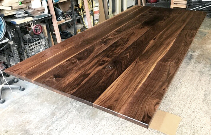 Photos of solid wood walnut tables and tabletops