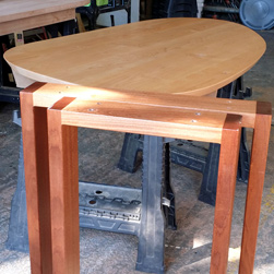 Monroe Table - Asymmetrical shape table top in supreme alder wood and mahogany base