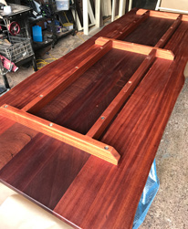 Bandera Table - Bottom side of a mahogany table top with battens and support frame