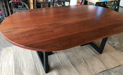 Wells Table - Large oval mahogany table on black base