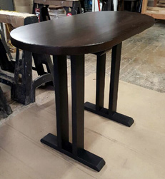Springfield Table - Small oval table finished with bronze walnut on black trestle base
