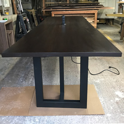 Richardson Table - Large bronze walnut table with live edge cut and grommet for a conference table