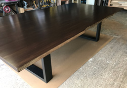 Richardson Table - Large bronze walnut table with live edge cut on black base