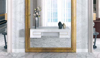 Custom framed mirror with large gold frame