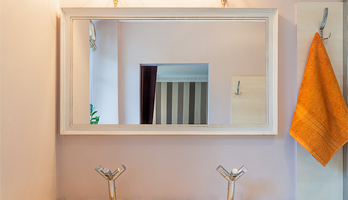 Bathroom mirror with rustic white frame