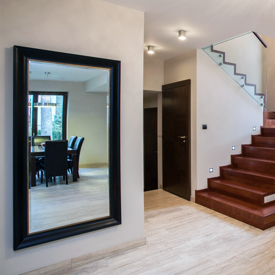 Black gold frame mirror in entrance entry hallway