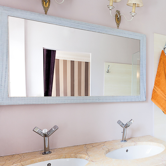 Rustic white framed mirror for beach house